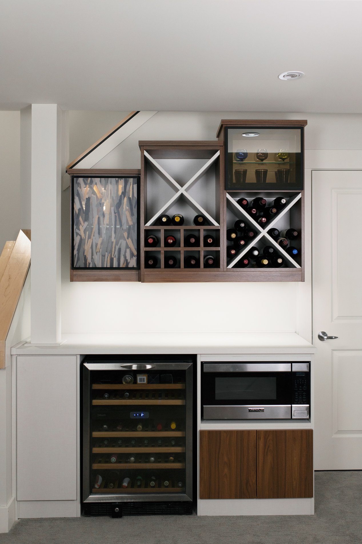 Fun Basement Wine Bar Basement wine bar with open wine storage, and built in appliances.