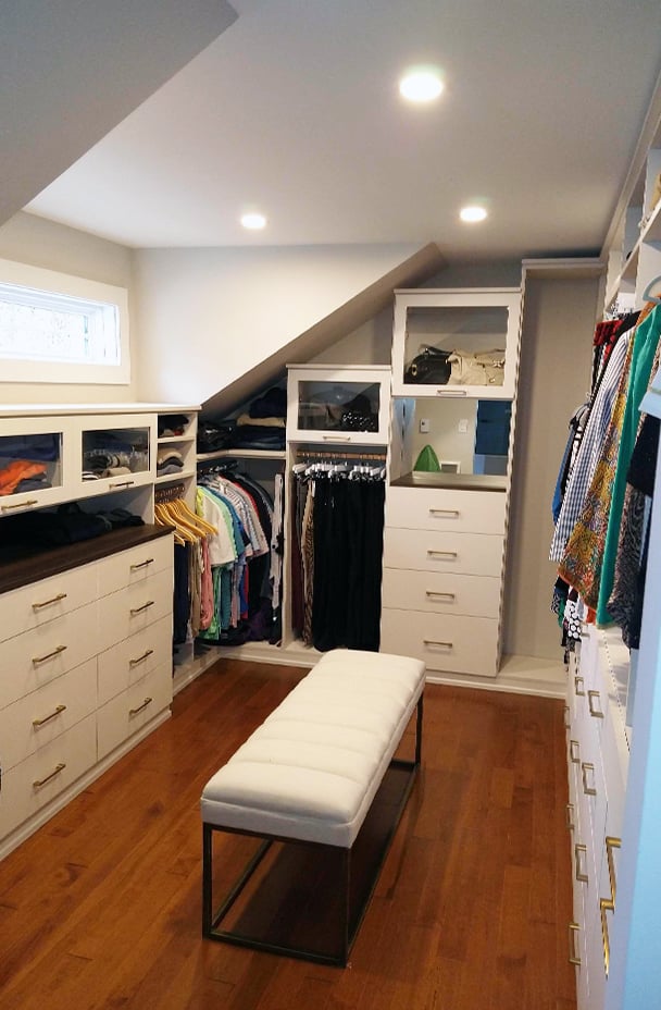 Custom Walk In Closet | California Closets Southern New Jersey Small walk-in closet with cabinets, dresser, cubbies by California Closets Southern New Jersey.