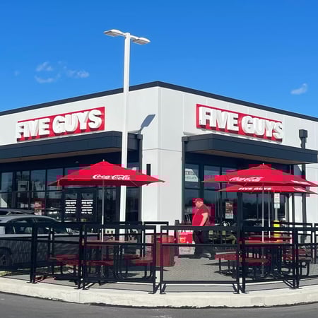 Exterior photograph of the Five Guys restaurant at 24 Terroso Way in Inwood, West Virginia.