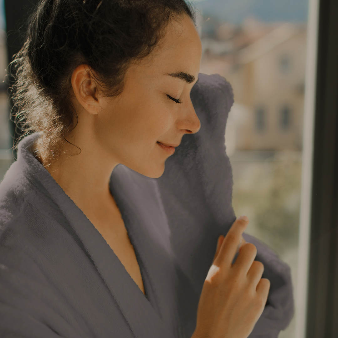 woman smiling in spa robe