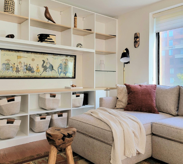 Contemporary Living Room living room with white bookshelves floor to ceiling custom shelving for collectible items to display New York City