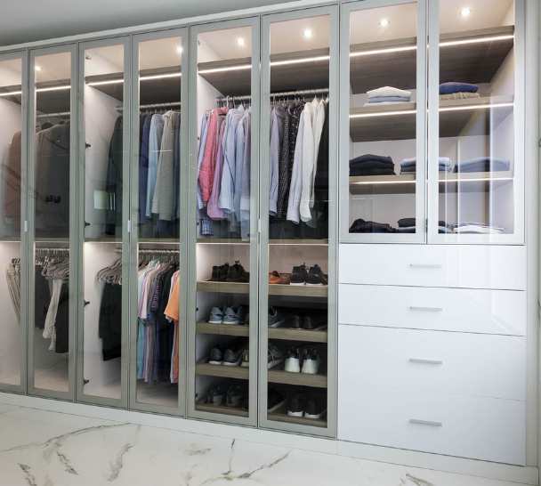 Luxurious White Walk-in Closet Luxurious white and silver walk-in closet custom built by California Closets Nassau County, New York