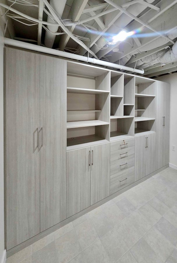 Custom Basement Wall Unit with Integrated Storage Wall unit, custom storage, built-in cabinets, shelving, drawers, home organization in Canton, Michigan