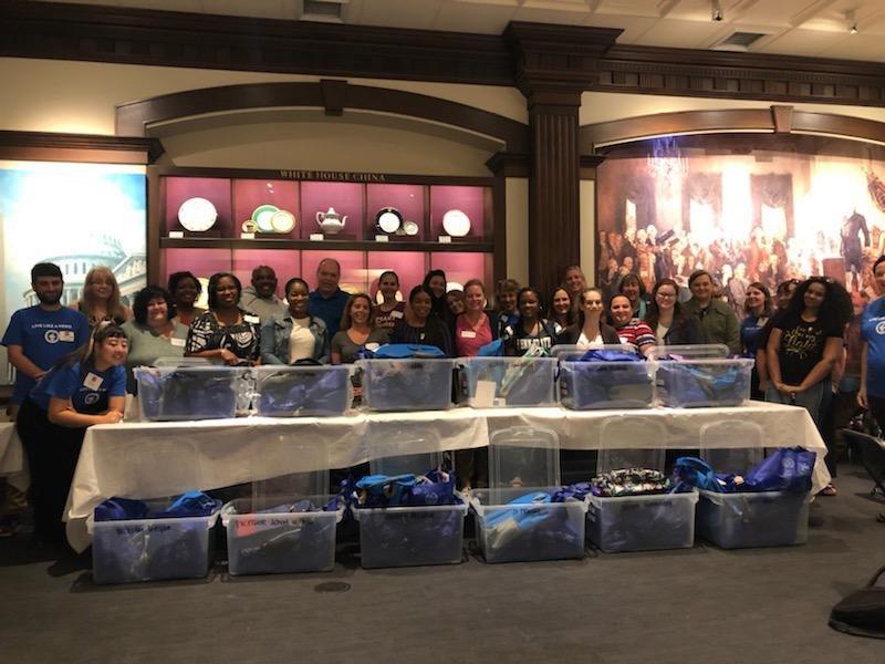 Agent Tom La Croix with Philadelphia school teachers picking up school supplies donated through the 2019 Allstate drive.