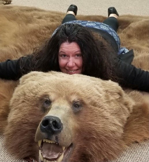 Cheryl clowning around with a world class brown bear taken by Bob Hodson