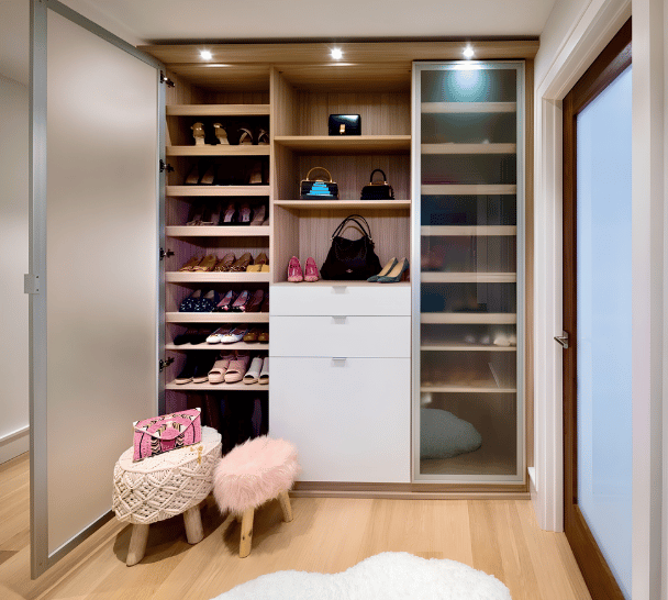 Stylish Shoe Nook Stylish shoe closets with frosted glass doors, shoe shelves and white drawers in center