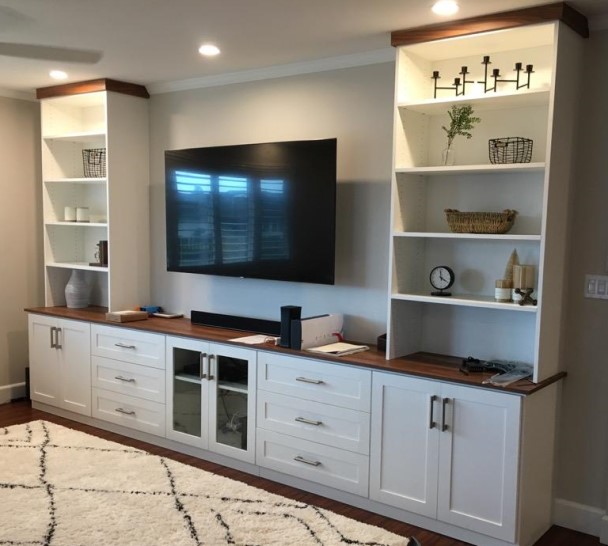 Two-Toned Contemporary Media Center Media center with side shelving, lower cabinets and drawers provides plenty of storage opportunities.