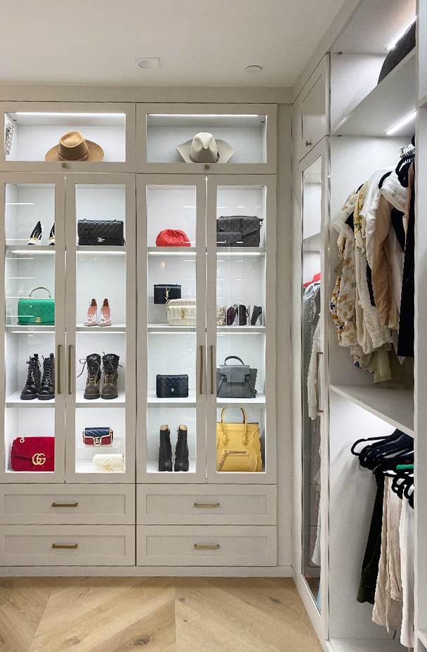 Walk-In Closet Shoe Racks | California Closets Orange County Walk-in closet with shoe and handbag storage, drawers in white wood by California Closets Orange County.