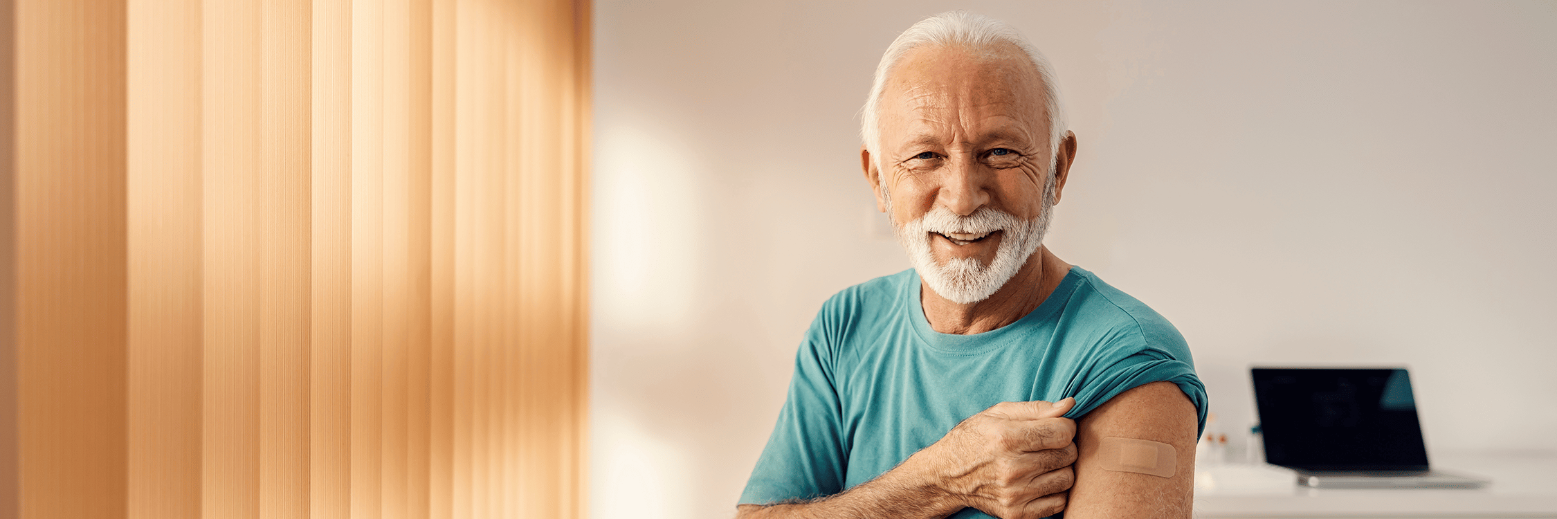 elderly man getting his vaccines up to date