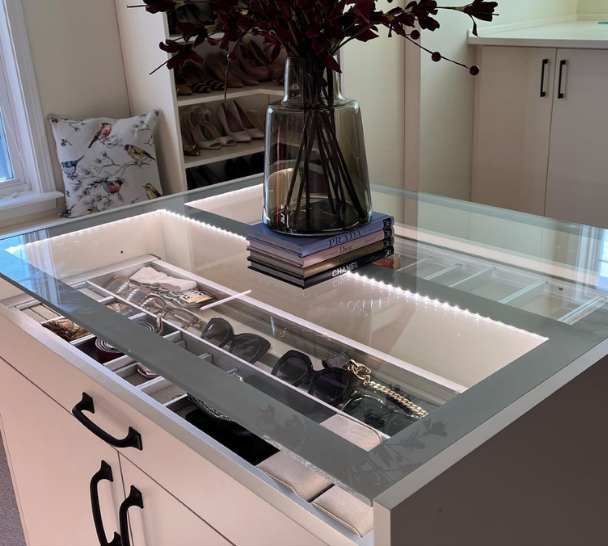 Custom Storage Island Custom storage island in a walk-in bedroom closet.