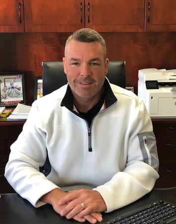 Allstate agent Joseph O Neill in front of brown background