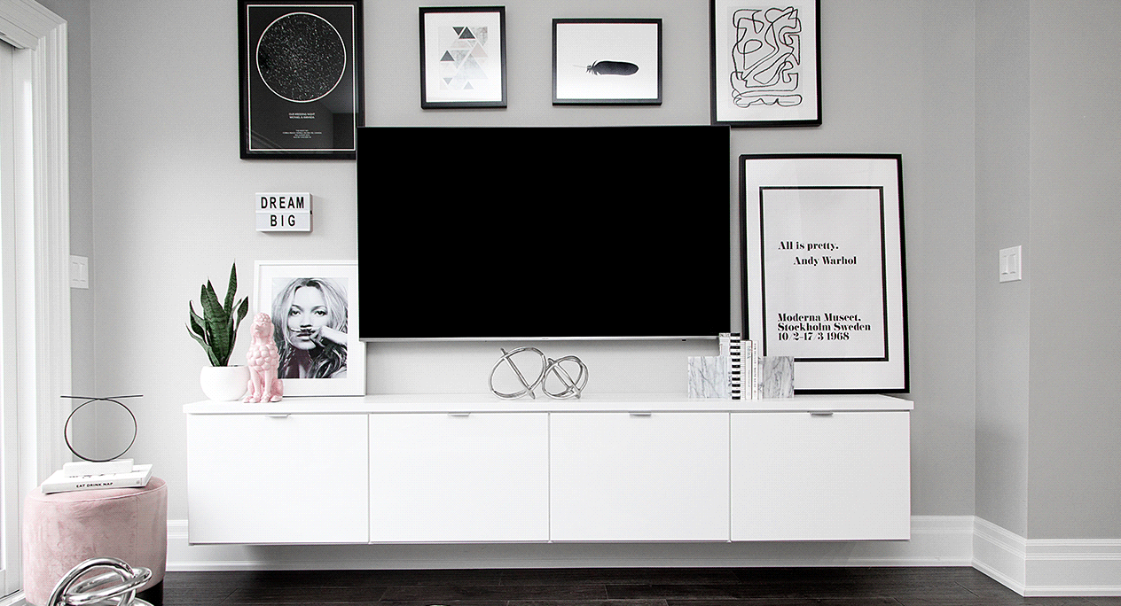 White floating media center Modern floating media center with tv and pieces of wall art by California Closets Portland, Oregon.