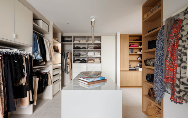 Custom White Walk-in Closet Img 2 - California Closets Westchester County New York Dressing Room Walk-in White and Natural Wood Closet with Center Island Storage for Hanging Shelving and Drawers
