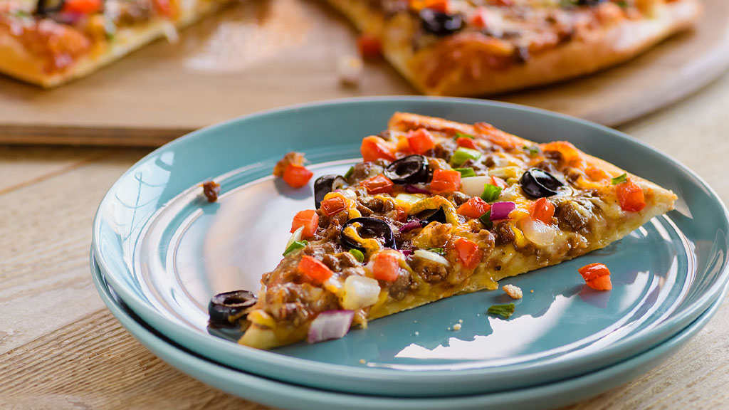 slice of Papa Murphys take and bake Taco Grand pizza on a plate