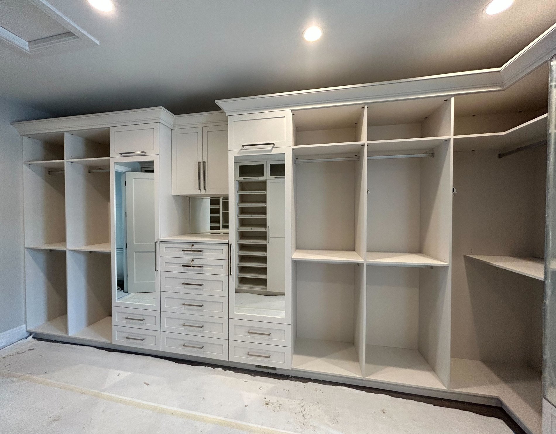 Custom Wall Unit Custom Wall unit with stacked drawers, 2 mirrored doors, hanging, and light beige color
