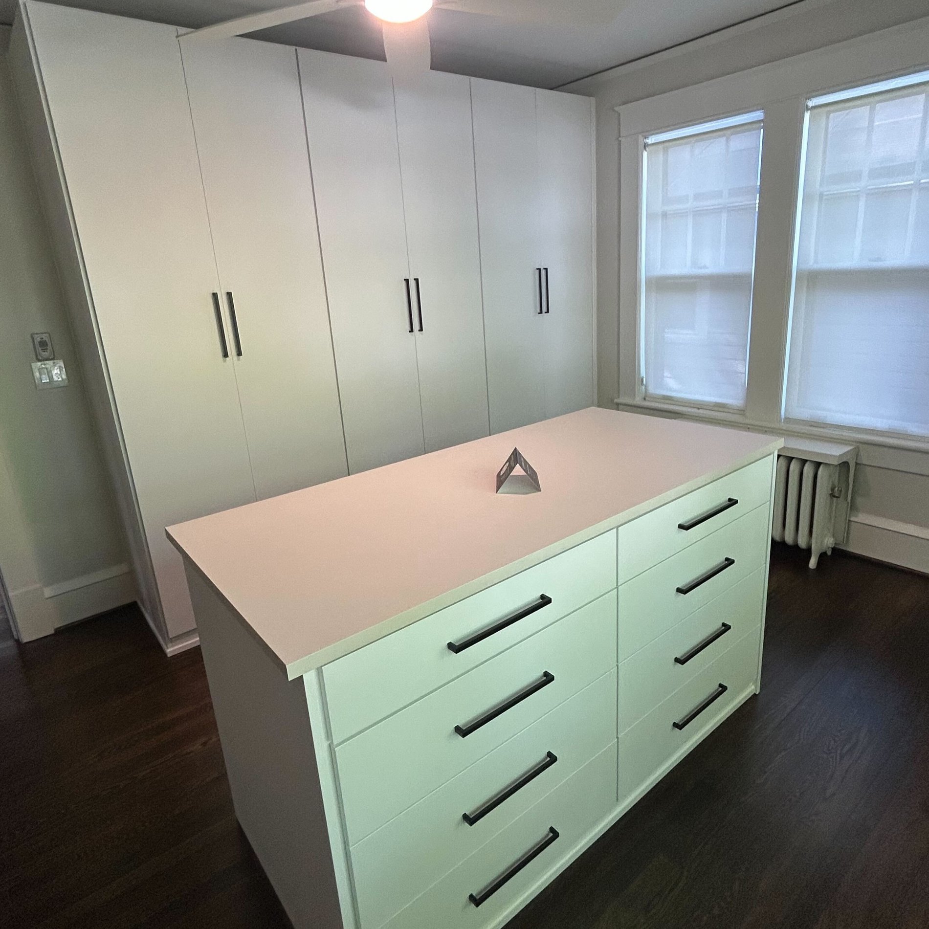Hallway Reach- In Closet Greensboro - Custom closets - walk-in closet with floor-to-ceiling cabinet doors and a center island for extra storage