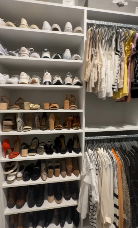 Floor to ceiling shoe rack and areas for hanging clothes by California Closets Virginia Beach, Virginia.