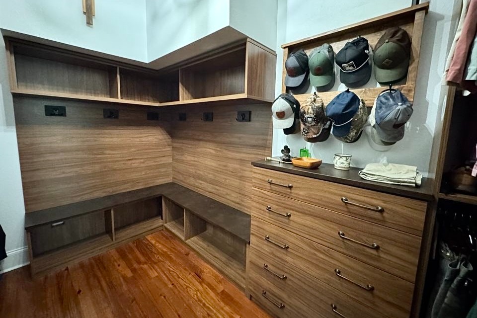 Brown Walk-in Closet Brown custom closets organization with a hat rack and drawers California Closets New Orleans & Gulf Coast, Covington, LA