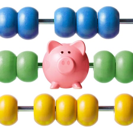 a piggy bank on an abacus