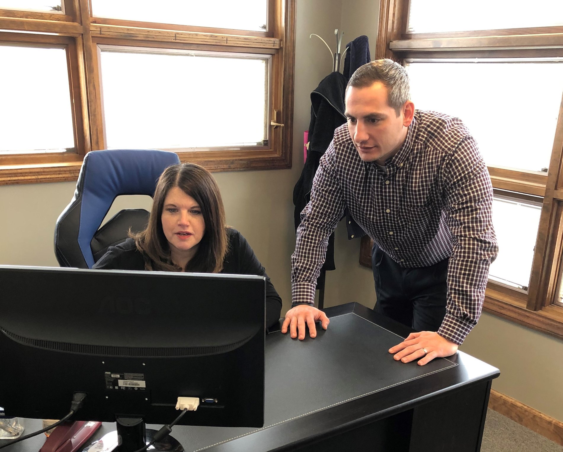 Josh and Tammy collaborating on an insurance review