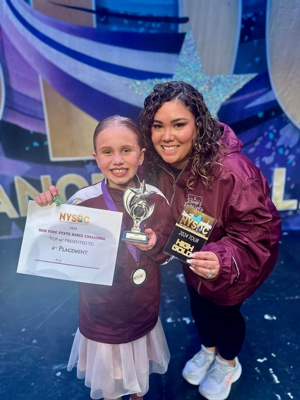 Evelyn winning a dancing award