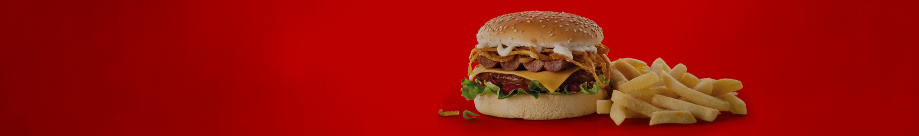 Wimpy burger with boerewors and chips on a plate.