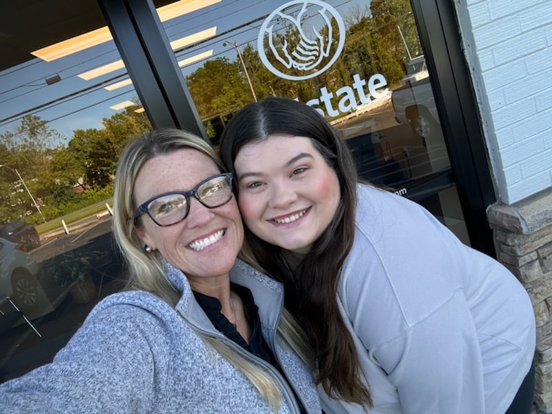 Sarah and Savanna at front office door