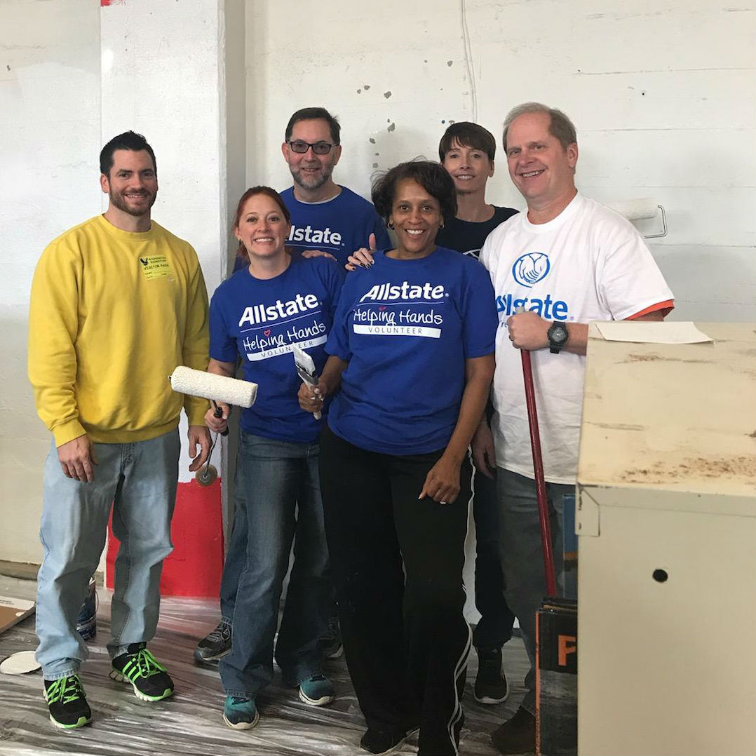 With other Allstate agency owners, helping remodel the Washington Elementary School library.