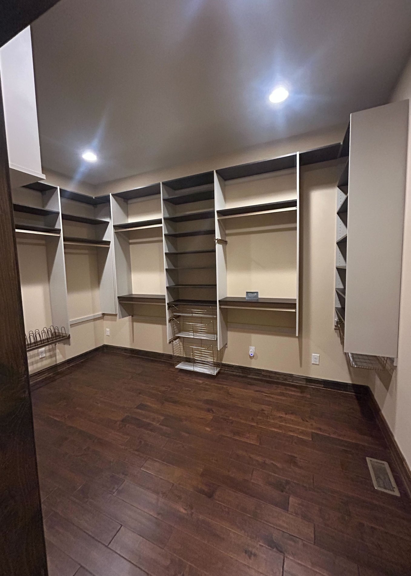 Sleek home office desk Greensboro - Custom closets - Walk-in closet with plenty of racks for hanging clothing and shelves for storage