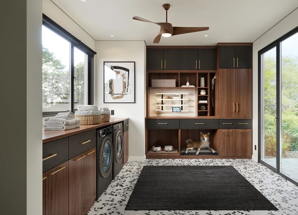 Laundry room with cabinets, drawers, and pet food storage in wood finish by California Closets Buffalo and Rochester, New York.