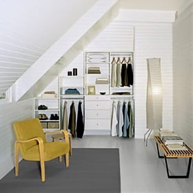 Customize your small, angled spaces to maximize your storage solutions Under the stairs custom storage in a reach-in closet design with shelving and drawers created by California Closets