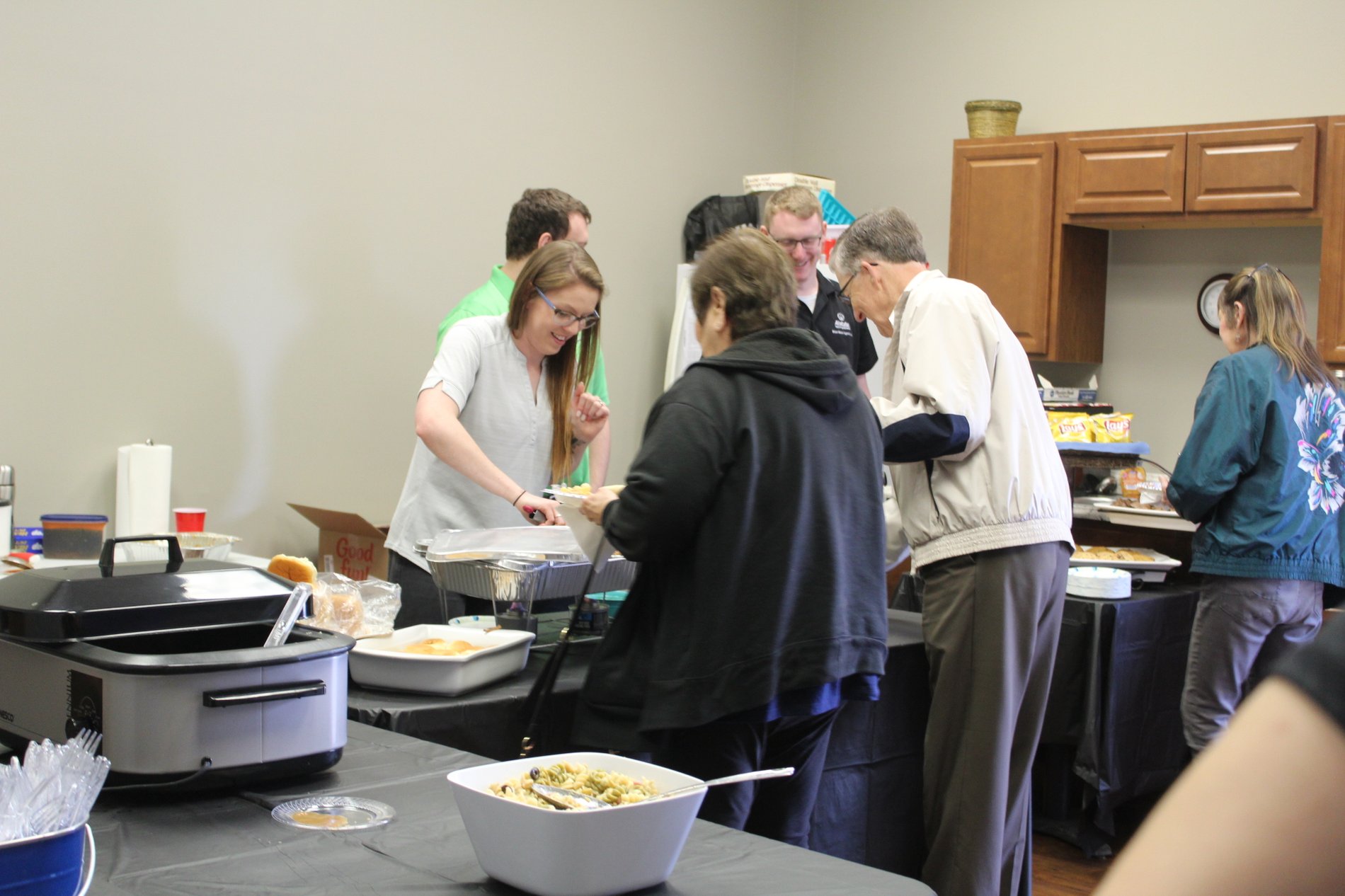 2019 Customer Appreciation Event. Samantha and Matt serve up pulled pork to hungry Customers.