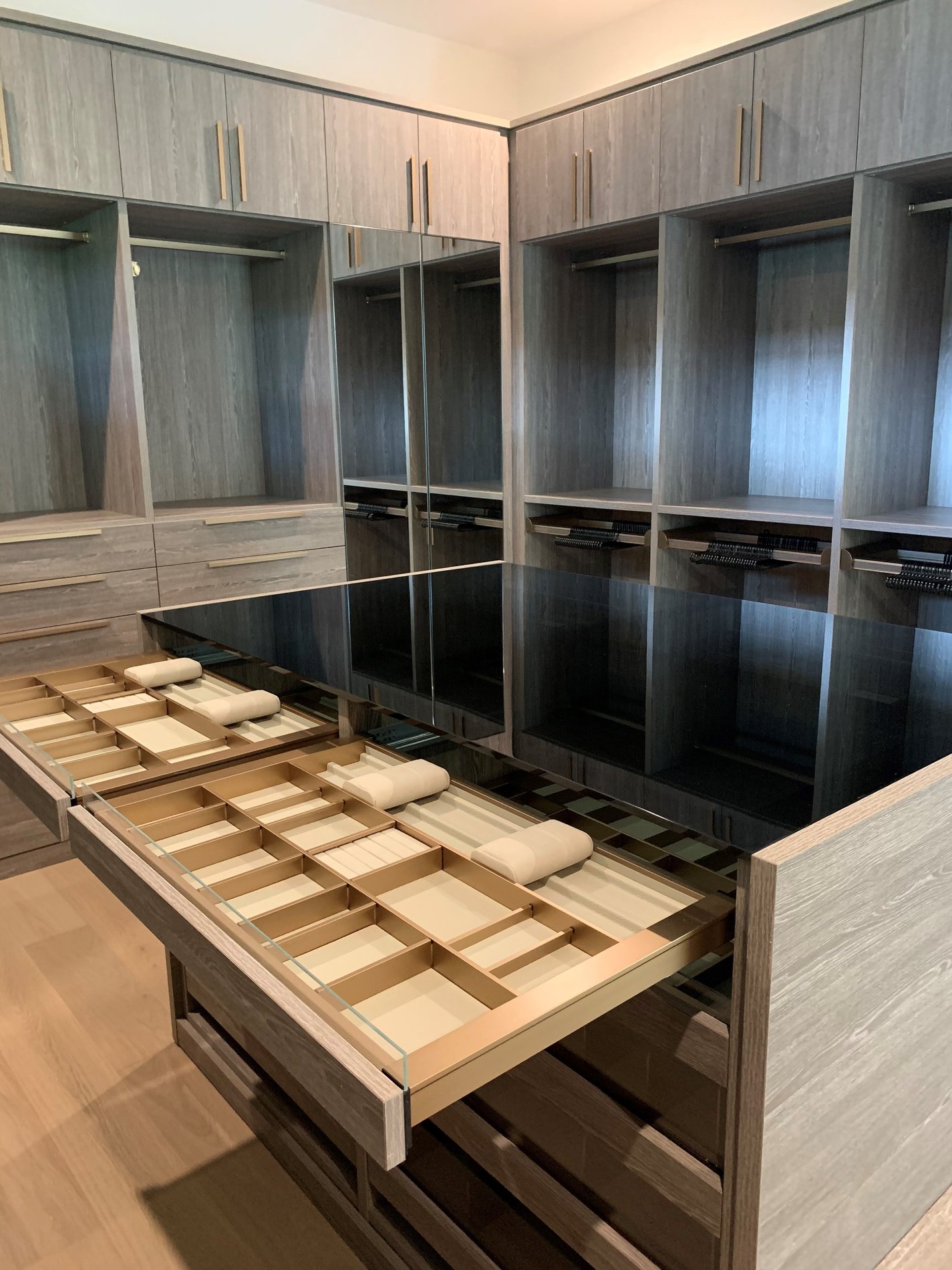 Walk In Closet Custom Walk In Closet with Glass top Island using our ever style system for the jewelry inserts.