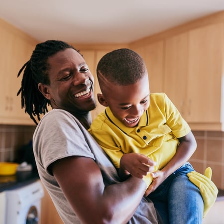 A man holding a young boy