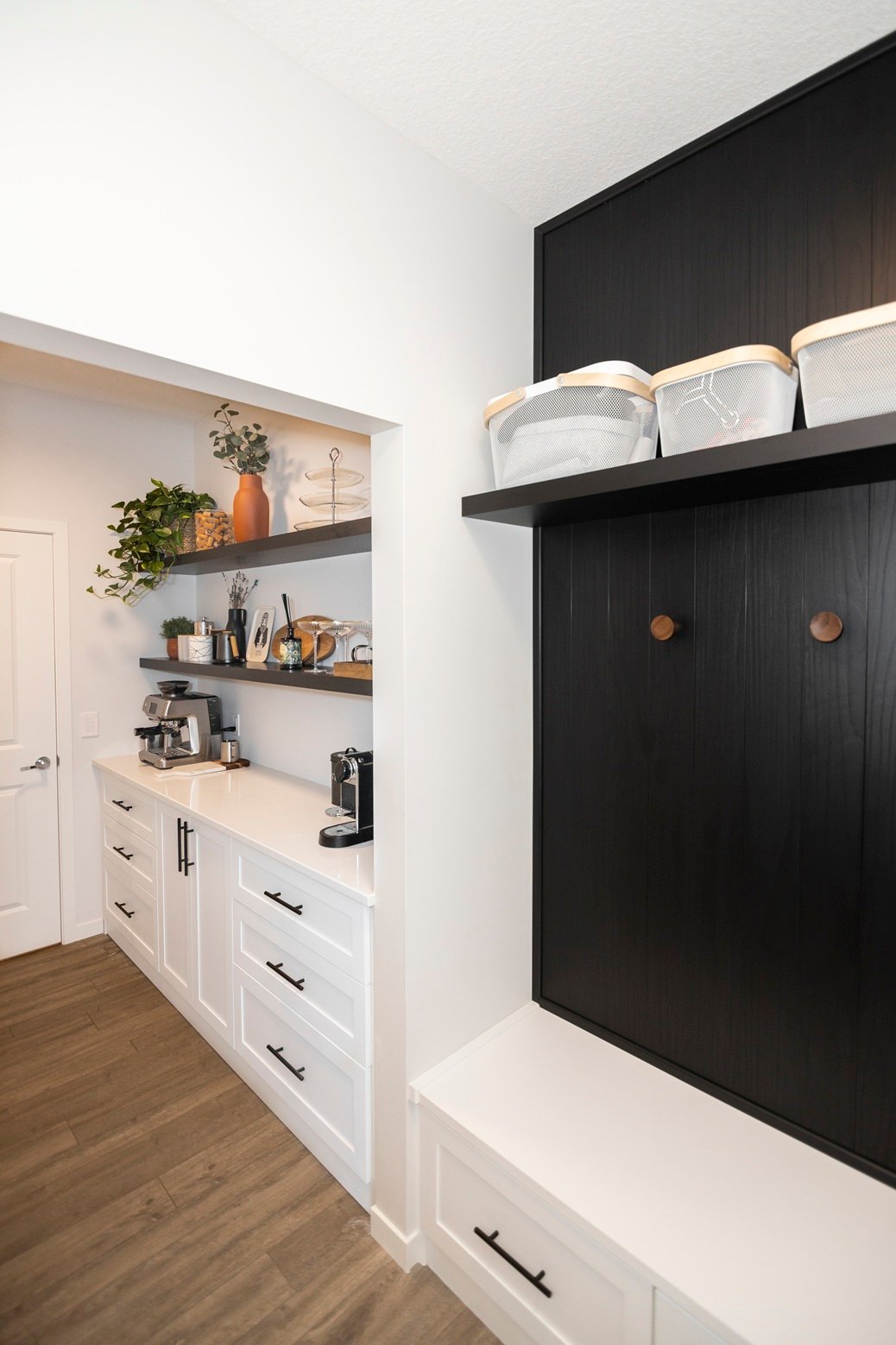A Clean and Fresh Mudroom and Coffee Bar Mudroom and coffee bar combination with white cabinetry and black shiplap backing.