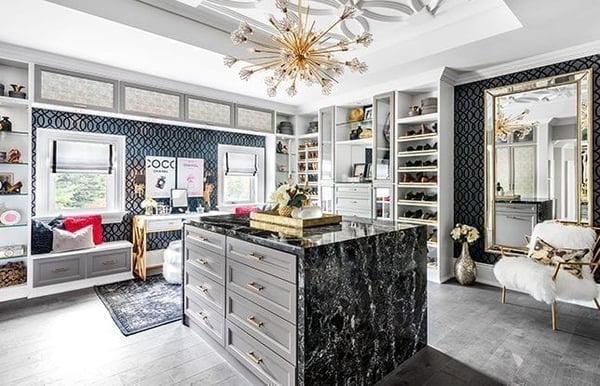 Creating wow factor for HGTV’s Sabrina and Scott McGillivray Walk-in dressing room with custom island storage, shoe shelves, and accessory displays by California Closets