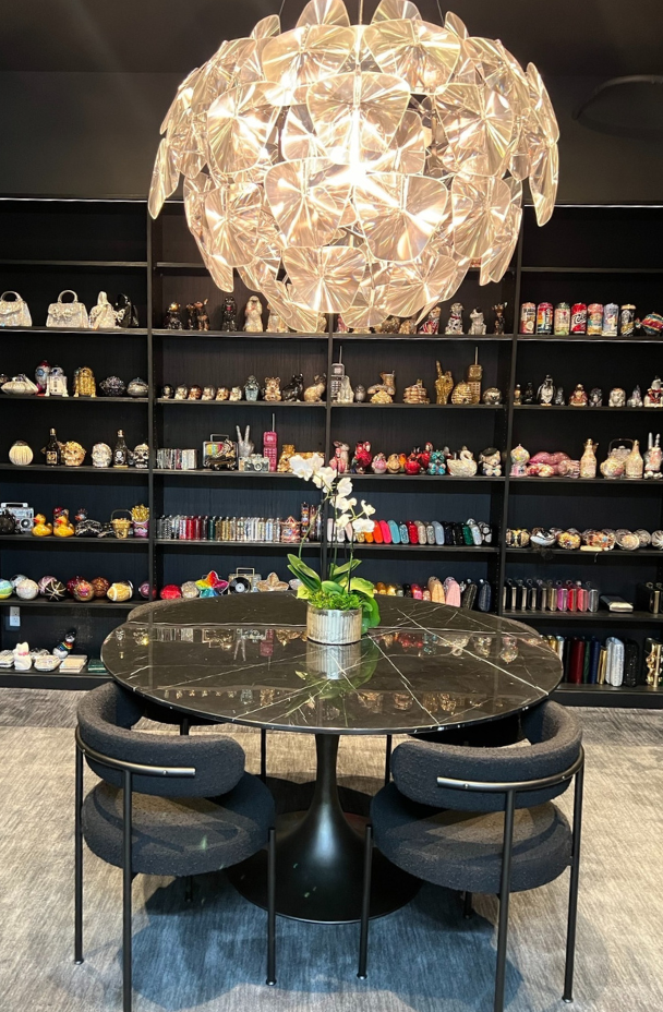 Modern Showroom Boutique California Closets Brooklyn New York black custom bookshelves storage display custom built unit for store purse collection shelving and drawers luxury closets crafting storage