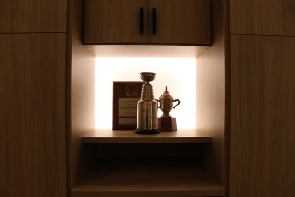 Featured in Woodworking Network Fitness room storage with Stanley Cup showcase, designed by California Closets Nashville, Tennessee