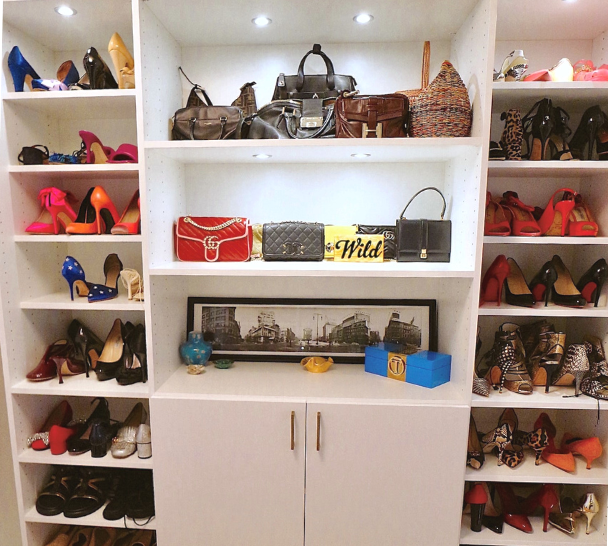 White Shoe Wall Storage floor to ceiling shoe wall white closet with puck LED lighting and shelving to display purse collection in walk-in closet manhattan new york