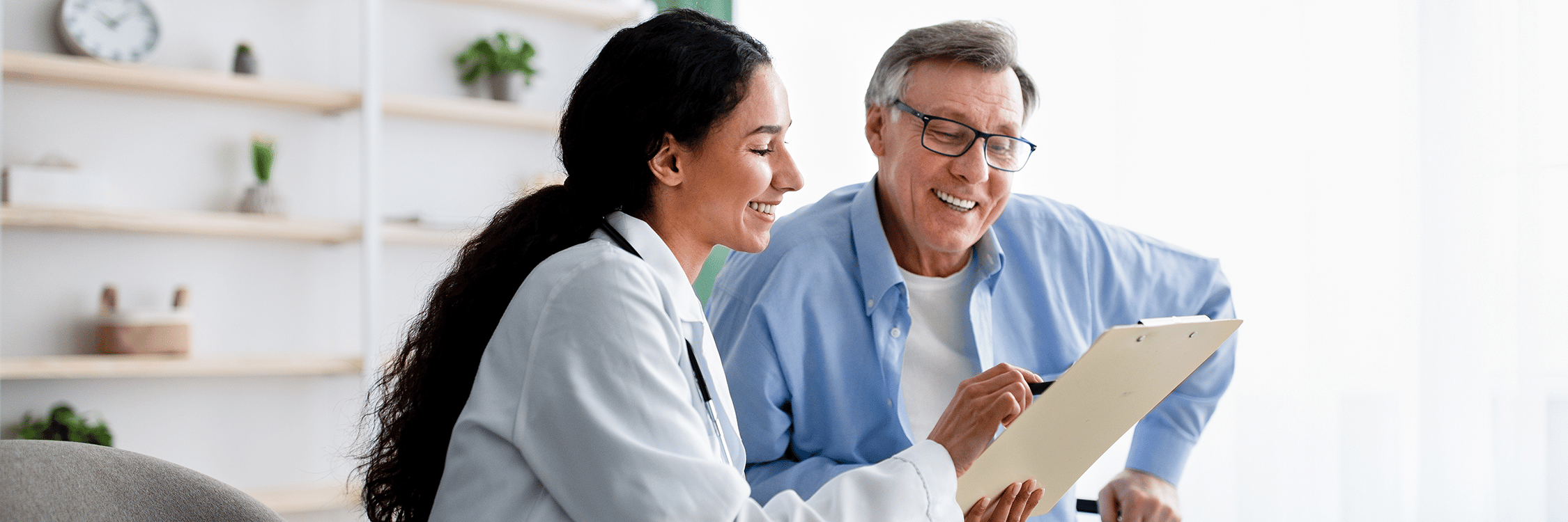 doctor and patient discussing paperwork