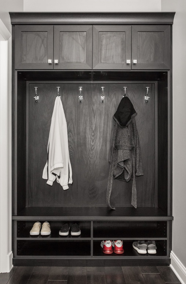 Entryway Storage Entryway storage with cabinets, hanging hooks, and shelving.