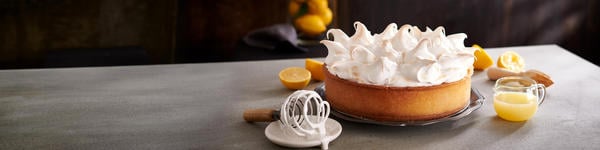 Mugg & Bean's lemon cake served on a grey table.