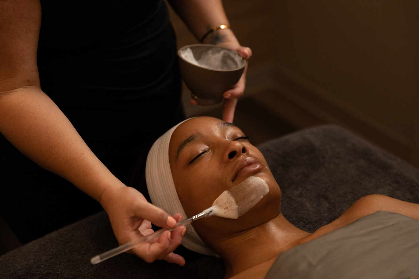 Female spa guest receiving Woodhouse facial