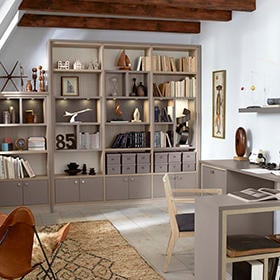 Three innovative ideas for your home office Large custom shelving with cabinets in office with desk and chair by California Closets Northern Michigan