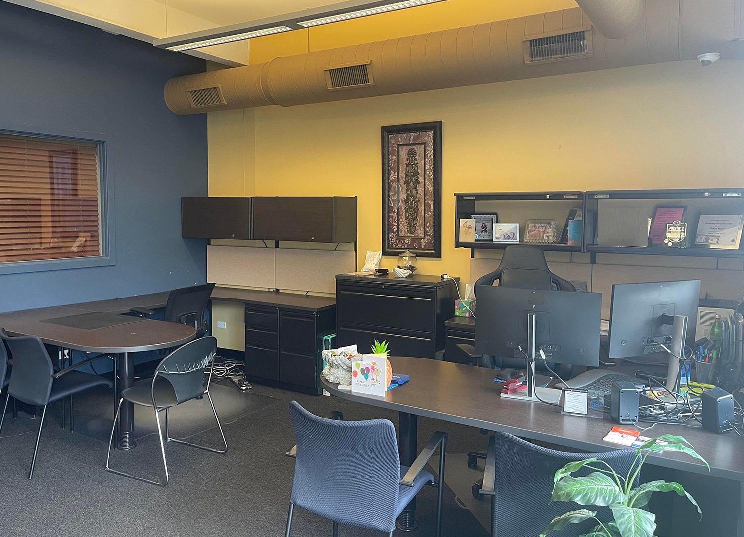 Debbie's desk and an open table inside the agency