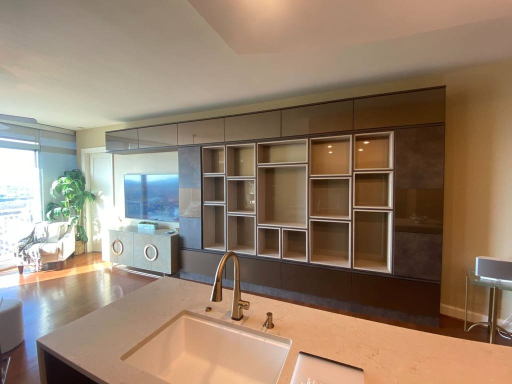 White Wall Bed Richmond - Custom closets - Living room entertainment center covering the entire wall with cabinets and cubbies