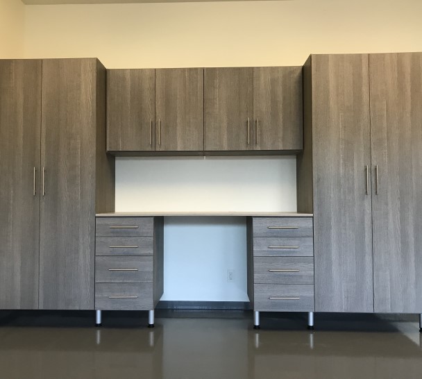 Ash and Pietra Garage Grey garage and workbench with tall storage cabinets