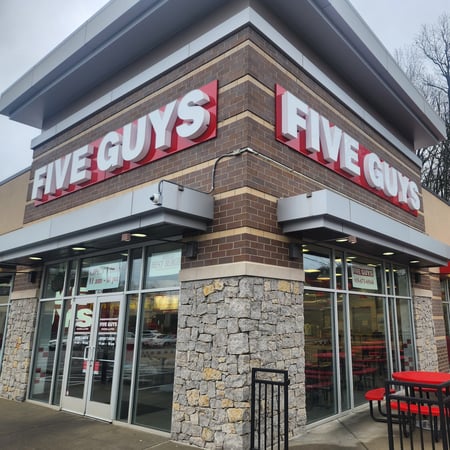 Photograph of the exterior of the Five Guys restaurant at 7026 Highway 70 South in Nashville, Tennessee.