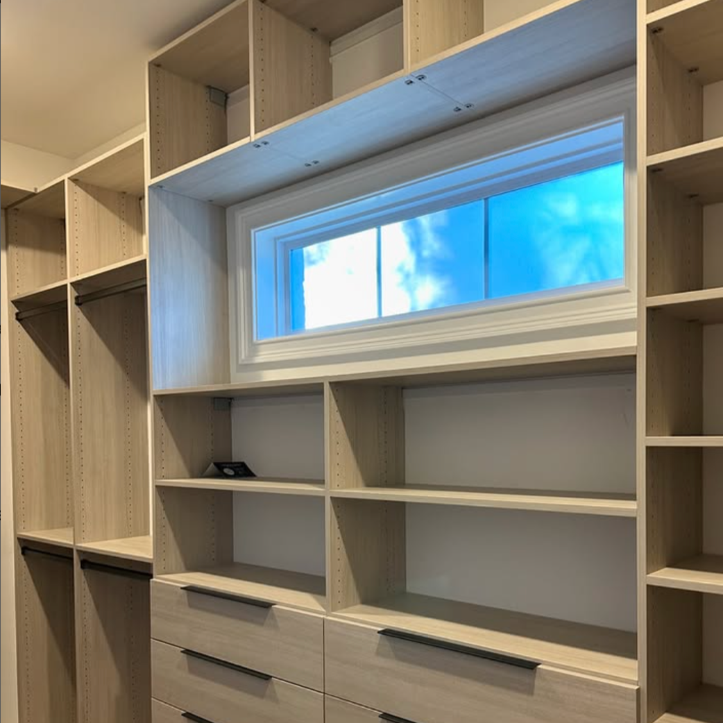 Custom Walk-in Closet Custom walk-in closet with view of outside.