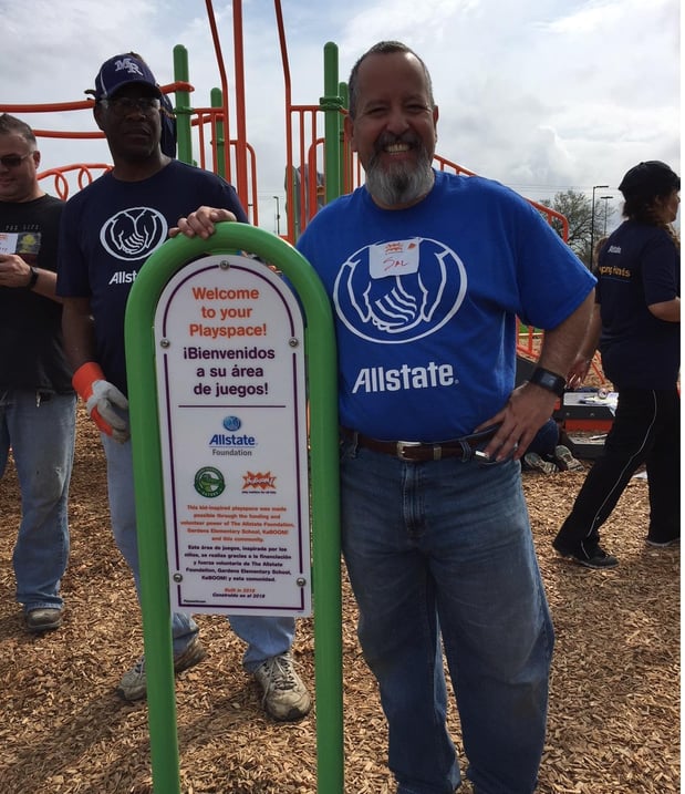 Agent Sal Ortiz, along with fellow Allstater's setting up a playground at an elementary school in Pasadena, TX. Playground equipment was donated by the Allstate Foundation.